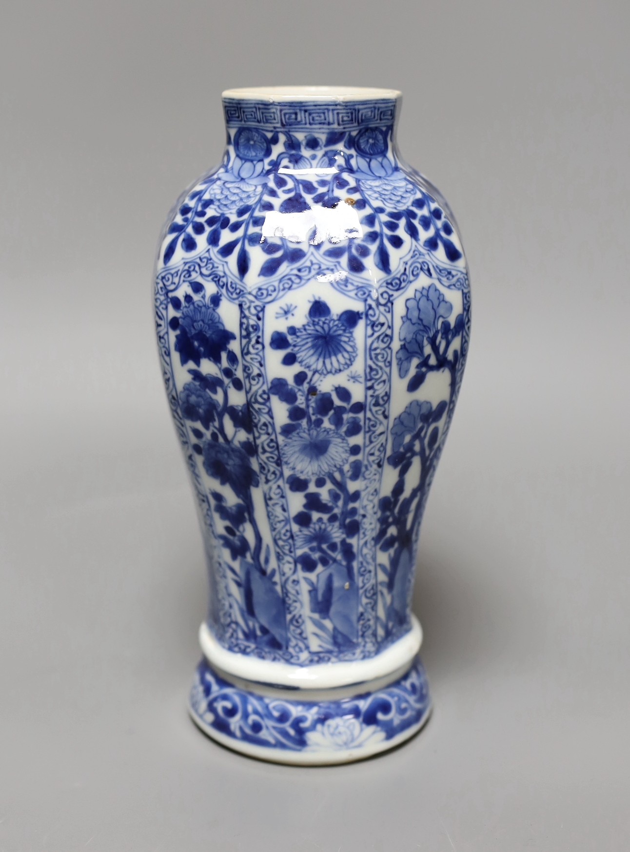 A Chinese blue and white vase, Kangxi period, 23 cms high